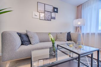 canva floor lamp beside sofa and window MADyQ1sGTEw